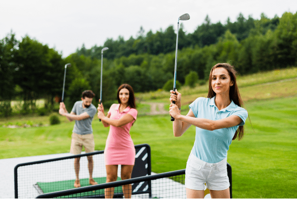 front-view-young-golfers-with-stick-up
